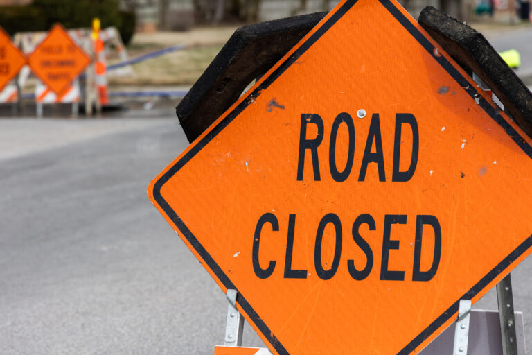 Road closed sign for street repairs in Pittsburg, KS